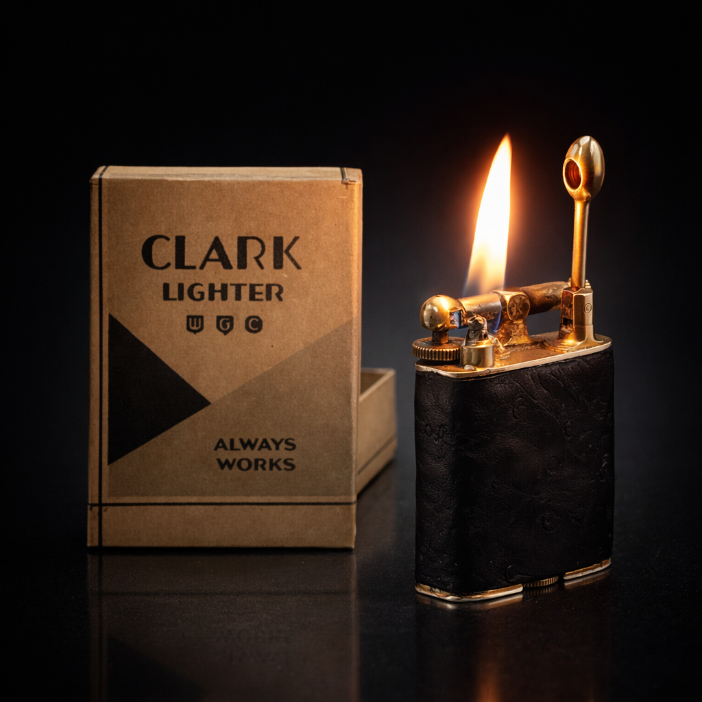 CLARK petrol lighter with box, flame lit on dark background